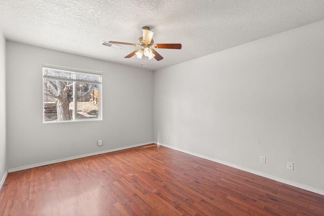 unfurnished room featuring a textured ceiling, ceiling fan, and wood-type flooring