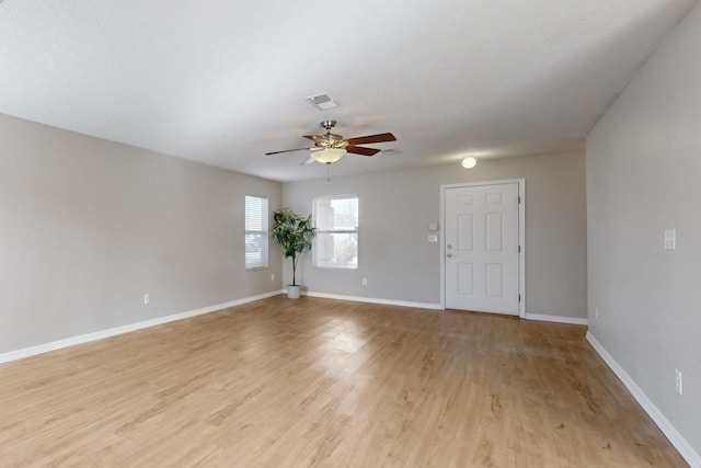 spare room featuring ceiling fan and light wood-type flooring