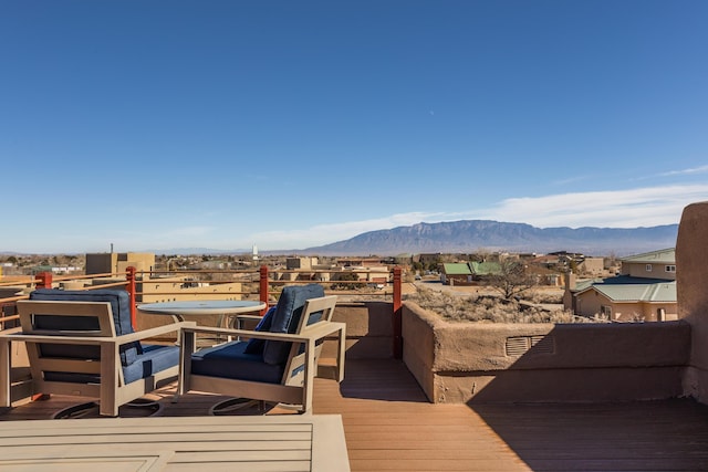 wooden deck featuring a mountain view