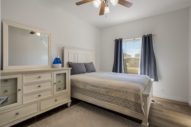 bedroom featuring dark hardwood / wood-style floors and ceiling fan