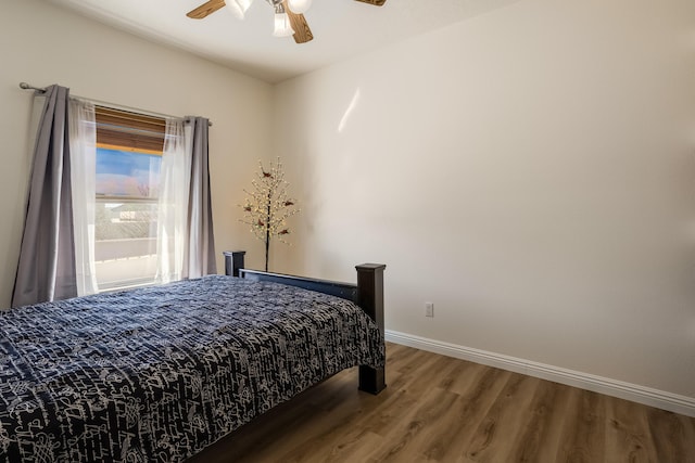 bedroom featuring wood-type flooring and ceiling fan