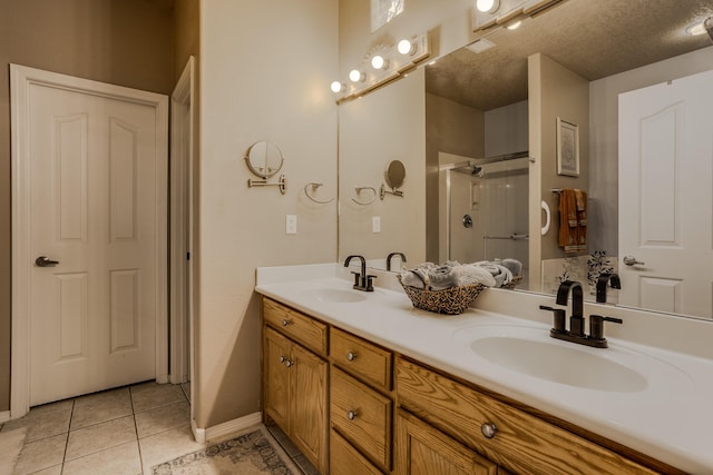 bathroom featuring vanity, tile patterned floors, and walk in shower