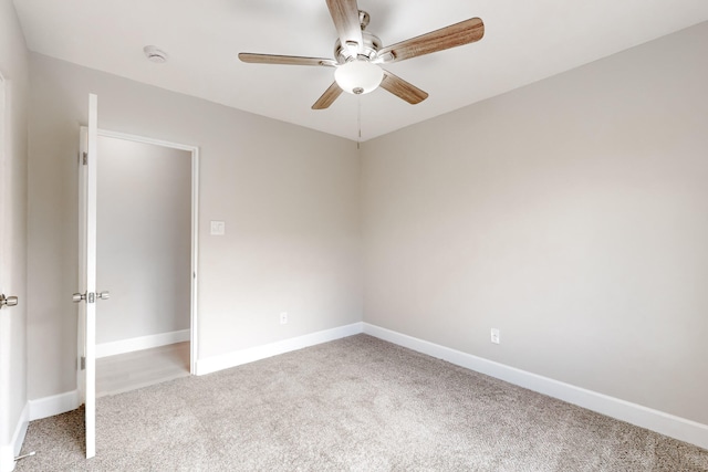 unfurnished bedroom featuring a ceiling fan, baseboards, and carpet flooring