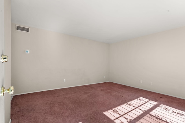 empty room with carpet flooring