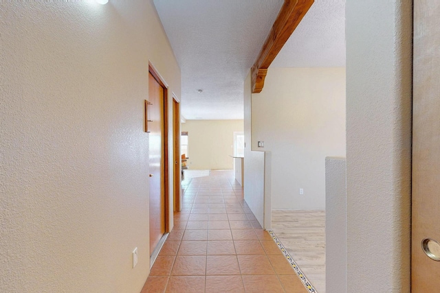 hallway with light tile patterned flooring