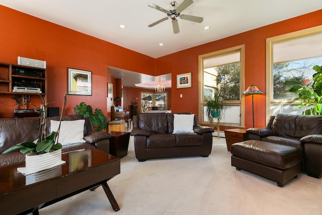 living room featuring a baseboard radiator, light colored carpet, and ceiling fan