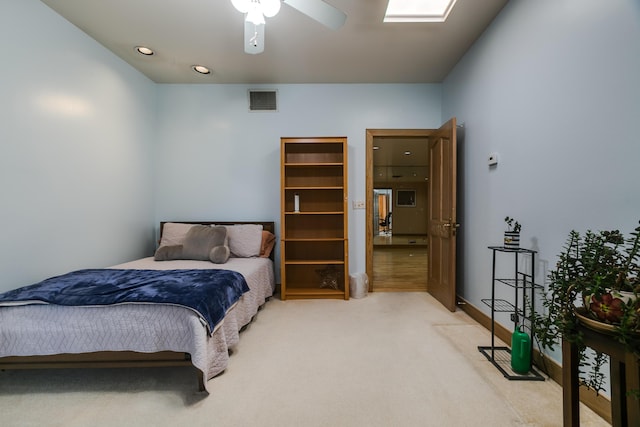 carpeted bedroom with ceiling fan