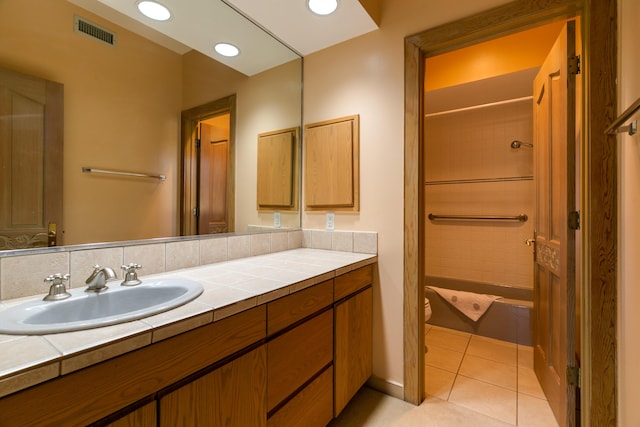 bathroom with vanity, tile patterned floors, and toilet