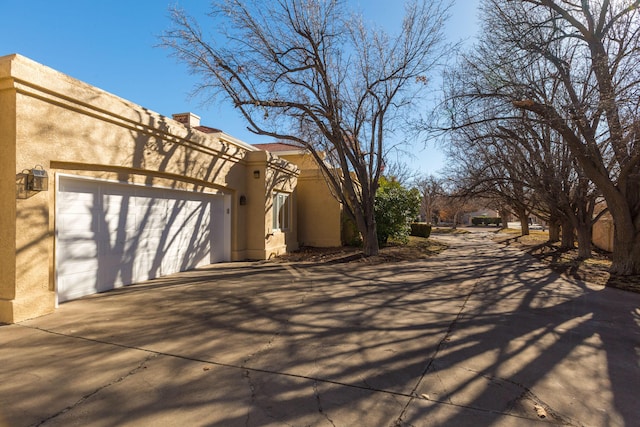 view of property exterior with a garage