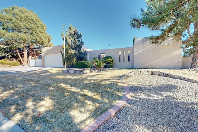 adobe home featuring a garage