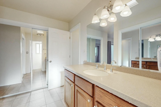 bathroom featuring tile patterned flooring and vanity