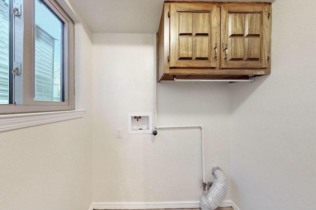 washroom featuring cabinets and washer hookup