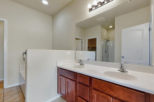 full bathroom with double vanity, visible vents, a sink, and a shower with shower door