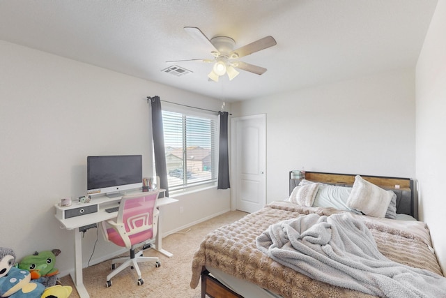 bedroom featuring light colored carpet and ceiling fan