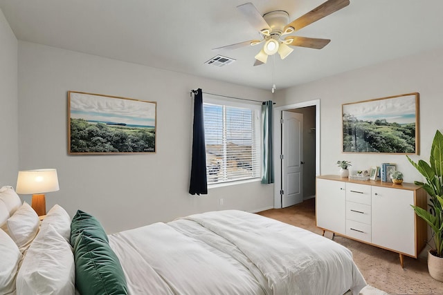 bedroom featuring baseboards, light carpet, a ceiling fan, and visible vents