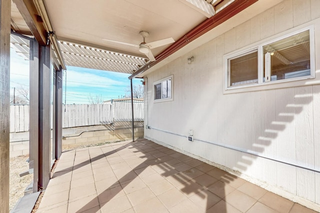 view of patio / terrace featuring fence and a pergola