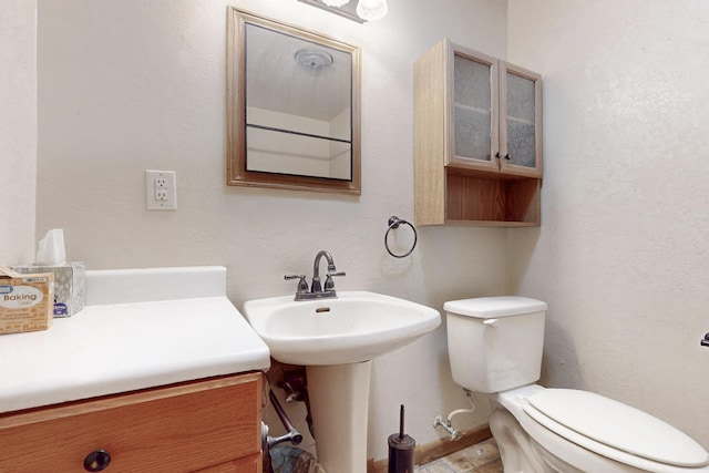 bathroom with toilet and a sink