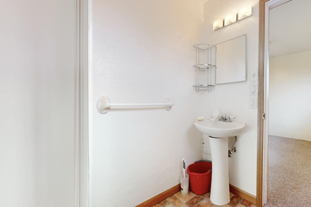 bathroom featuring baseboards