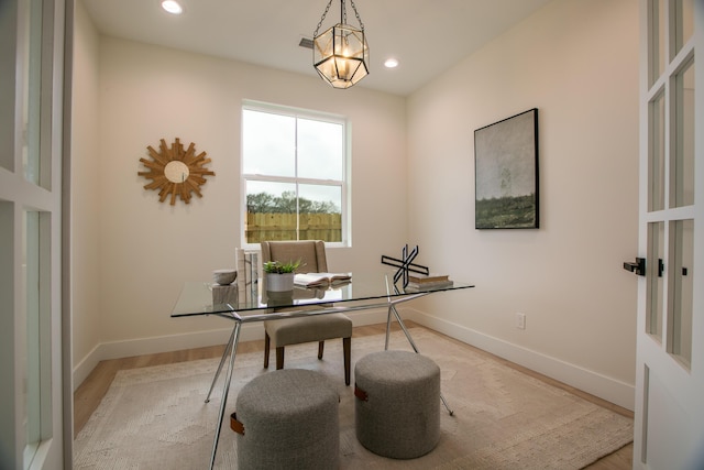 office space featuring light wood finished floors, baseboards, and recessed lighting