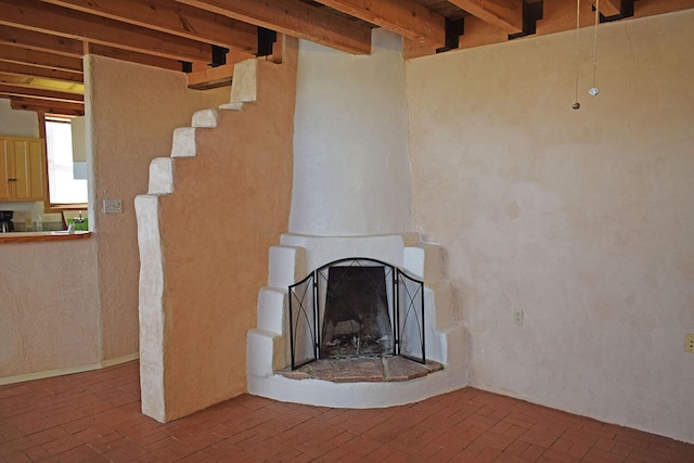 unfurnished living room with a large fireplace