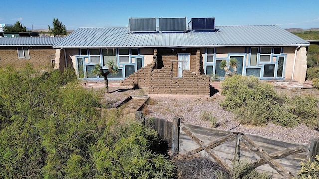 rear view of property with central AC unit