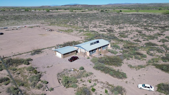 drone / aerial view featuring a mountain view and a rural view