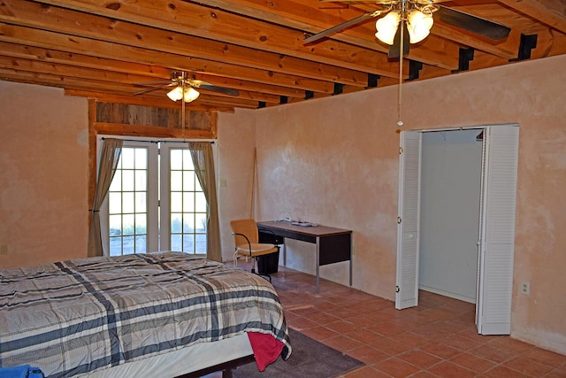 tiled bedroom featuring beam ceiling