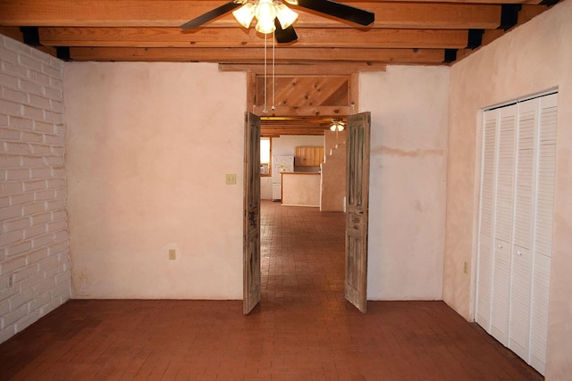 interior space featuring beam ceiling