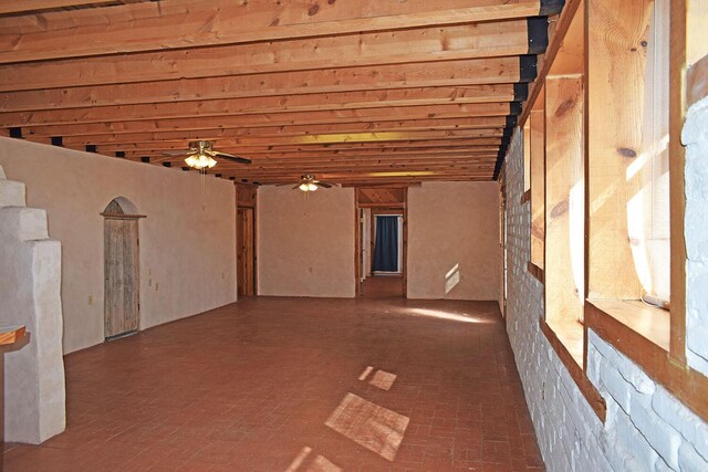 interior space featuring ceiling fan