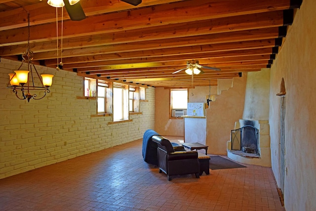 basement featuring ceiling fan and brick wall