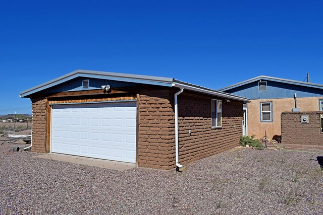 view of side of property with a garage