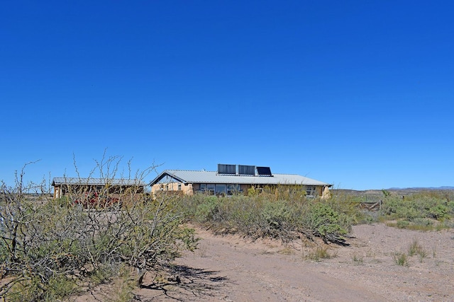 view of front of property with solar panels