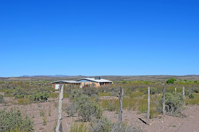 view of yard with a rural view