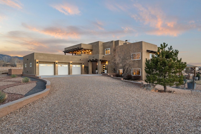 southwest-style home featuring a garage