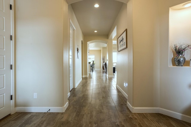 hallway with dark wood-type flooring