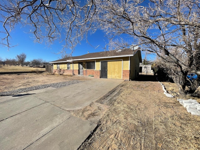 10613 Benavides Rd SW, Albuquerque, NM 87121 - single story home with brick siding and concrete driveway