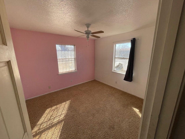 10613 Benavides Rd SW, Albuquerque, NM 87121 - unfurnished room with healthy amount of natural light, a textured ceiling, carpet, and ceiling fan