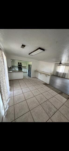 10613 Benavides Rd SW, Albuquerque, NM 87121 - corridor featuring light tile patterned floors