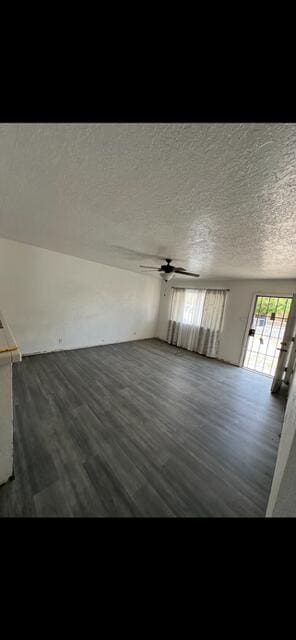 10613 Benavides Rd SW, Albuquerque, NM 87121 - unfurnished room featuring dark wood-style floors, ceiling fan, and a textured ceiling