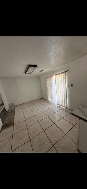 10613 Benavides Rd SW, Albuquerque, NM 87121 - unfurnished room with light tile patterned floors