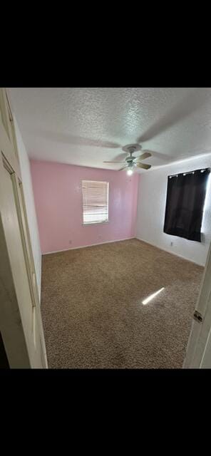 10613 Benavides Rd SW, Albuquerque, NM 87121 - unfurnished bedroom with carpet floors, a textured ceiling, and a ceiling fan