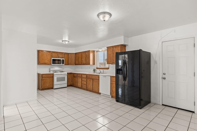 1613 Del Monte Trl SW, Albuquerque, NM 87121 - kitchen featuring sink, white appliances, and light tile patterned floors
