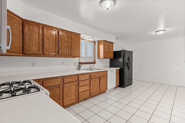 1613 Del Monte Trl SW, Albuquerque, NM 87121 - kitchen with light tile patterned flooring, sink, and white appliances