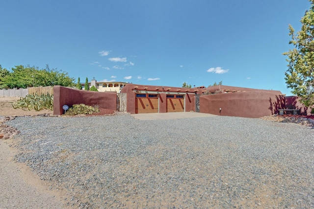 view of yard featuring fence and a gate