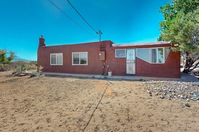 exterior space featuring stucco siding