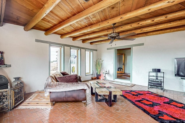 living room featuring wooden ceiling, a ceiling fan, brick floor, and beam ceiling