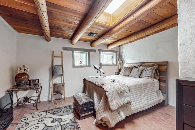 bedroom featuring beam ceiling, brick floor, a skylight, and wood ceiling