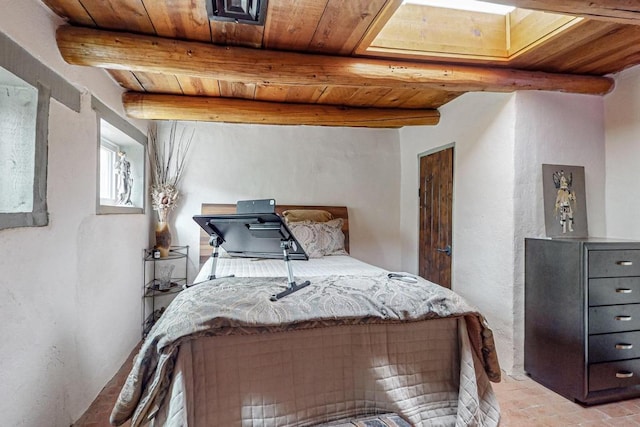 bedroom featuring wooden ceiling and beamed ceiling