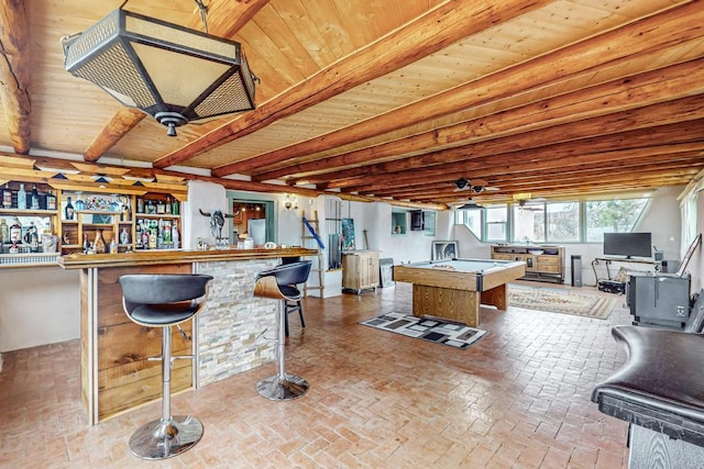 interior space featuring wooden ceiling, pool table, open floor plan, beam ceiling, and a center island