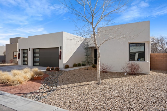 southwest-style home featuring a garage